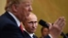 Президент США Дональд Трамп (на переднем плане) и президент России Владимир Путин на пресс-конференции в рамках двухстороннего саммита, Хельсинки, 16 июля 2018 года. 