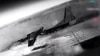 A screenshot from a video from Ukraine's Defense Ministry purports to show the downing of an An-26 aircraft at an airfield in Crimea. 