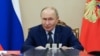 Russian President Putin chairs a meeting with members of the Security Council in Moscow on September 22.