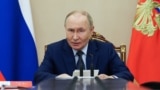 Russian President Putin chairs a meeting with members of the Security Council in Moscow on September 22.