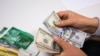 KYRGYZSTAN -- In Kyrgyzstan, the dollar has risen in price on February 24, 2022 . Dollar, som. Kyrgyz currency. Money. Bishkek, Kyrgyzstan.