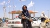 AFGHANISTAN -- A Taliban fighter looks on as he stands at the city of Ghazni, Afghanistan August 14, 2021. REUTERS/Stringer NO RESALES. NO ARCHIVES